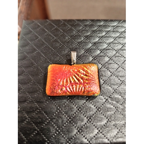 621 - Red gold starburst glass pendant 3cm