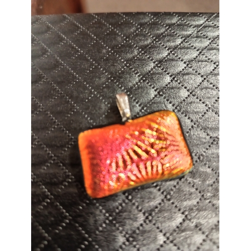 621 - Red gold starburst glass pendant 3cm