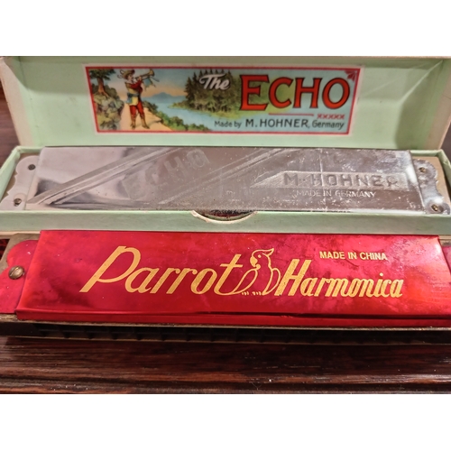 448 - Two vintage harmonicas, one in original box Echo made by M. Hohner Germany and one Parrot harmonica