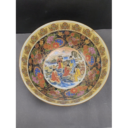 450 - Large ceramic chinese bowl depicting traditional scenes. H 14cm x W 30cm