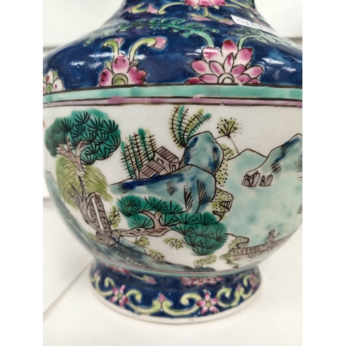 459 - Chinese decorative vase with mountain scene and decorated with pink flowers on blue Glaze H 25cm x W... 