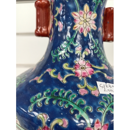 459 - Chinese decorative vase with mountain scene and decorated with pink flowers on blue Glaze H 25cm x W... 