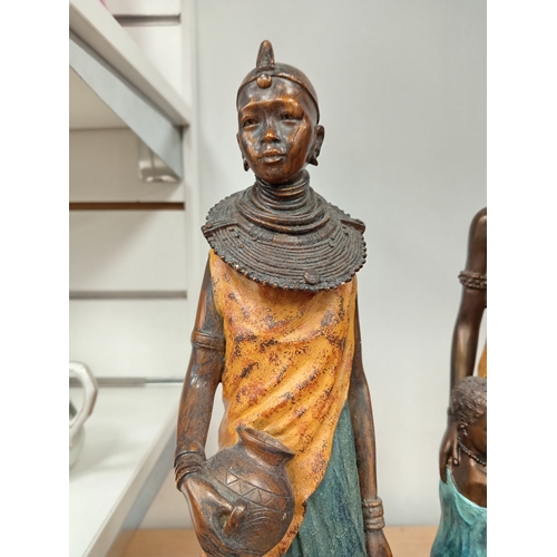 471 - Pair of African decorative lady figures one with child H 43cm x W 10cn and H 40cm x W 9cm