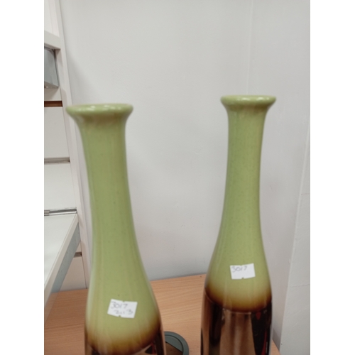 472 - Pair of green and copper effect glazed vases H 39cm x W 8cm