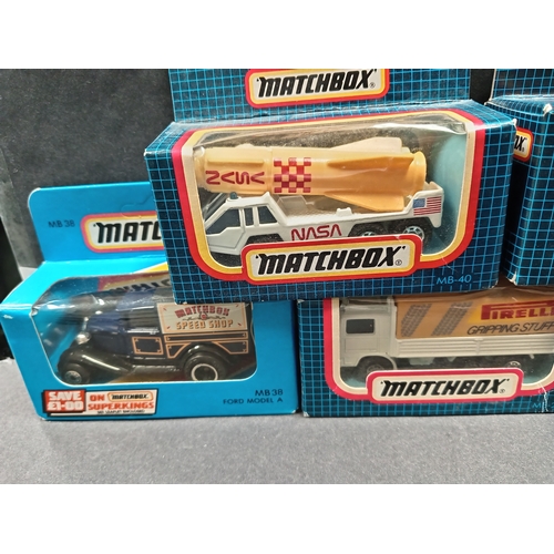 492 - Five boxed matchbox vehicles includes Ford Model A, Volvo tilt and GMC wrecker and rocket transporte... 