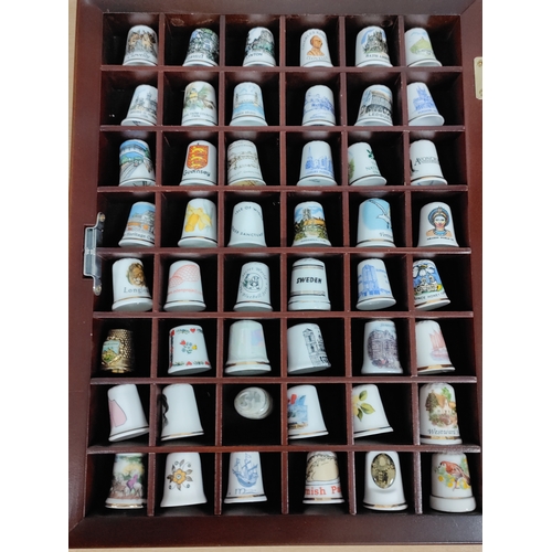 493 - Thimble wall display cabinet. Full of ceramic and metal thimbles from towns, countries and attractio... 