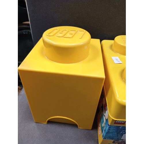 500 - Three lego storage boxes, Two small ones measure 15cm x W 12cm and one medium measures H 17cm x W 18... 