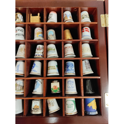 501 - Thimble wall display cabinet. Full of ceramic and metal thimbles from towns and countries.