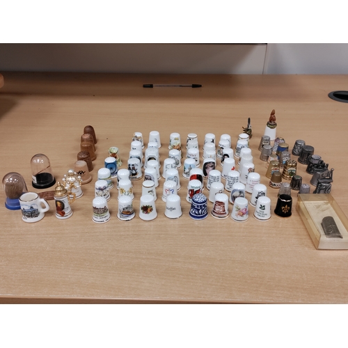 503 - Job lot of thimbles. Ceramic, pewter, wood and pressed coins