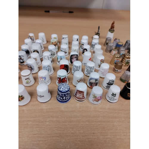 503 - Job lot of thimbles. Ceramic, pewter, wood and pressed coins