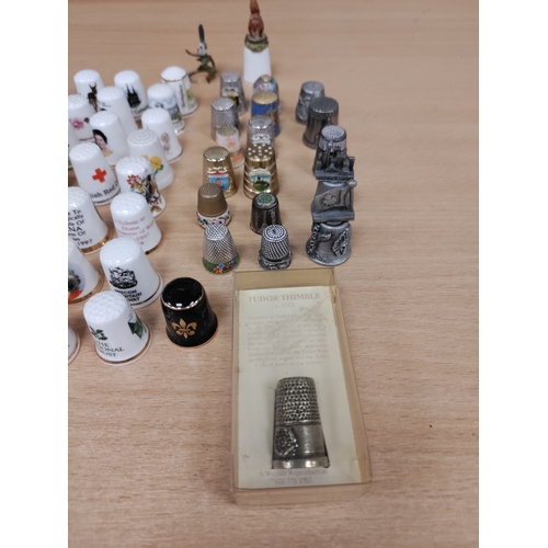 503 - Job lot of thimbles. Ceramic, pewter, wood and pressed coins