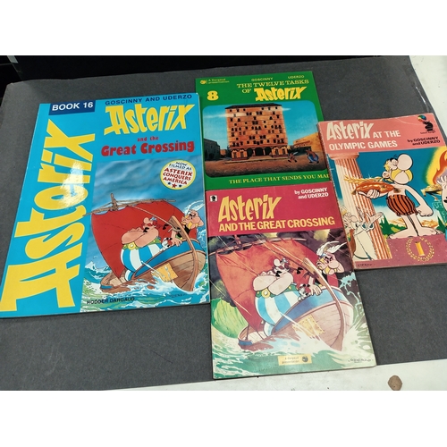 504 - Asterix large book and three small books