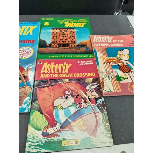 504 - Asterix large book and three small books