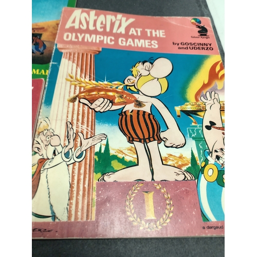 504 - Asterix large book and three small books