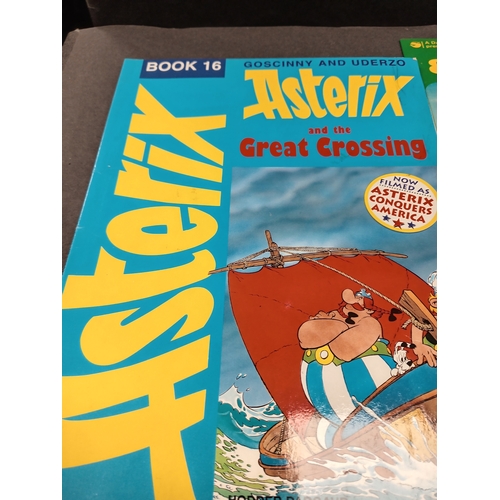 504 - Asterix large book and three small books