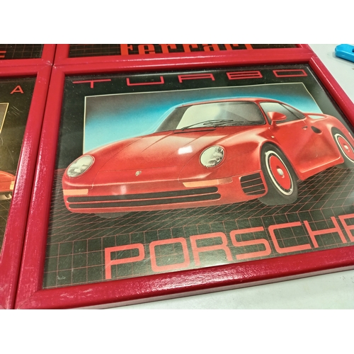 505 - Four vintage Red and black car prints framed includes two Porsche prints and two Ferrari pictures ea... 