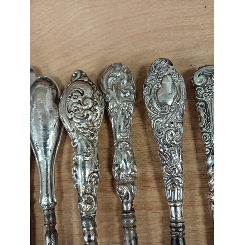 517 - Nine hallmarked Silver handled Victorian button hooks