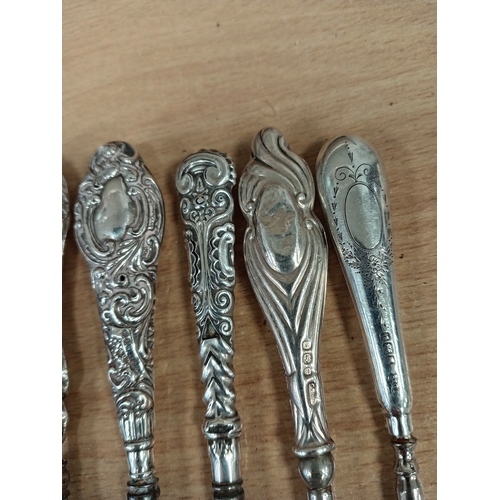 517 - Nine hallmarked Silver handled Victorian button hooks