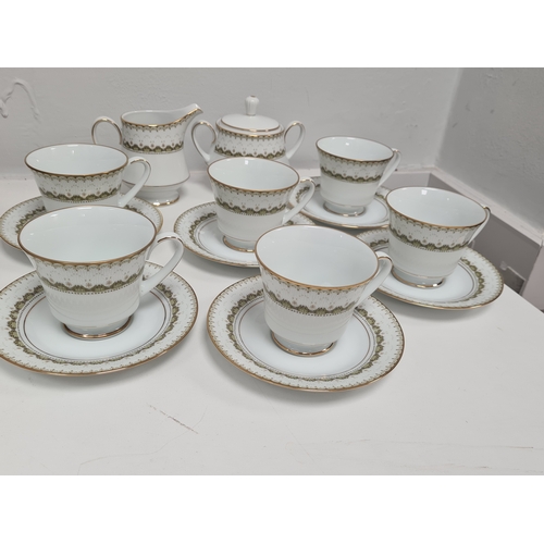 528 - Japanese Noritake Katrina Tea Set 2254 to include 6 cups, 6 saucers, milk jug and lidded sugar pot.