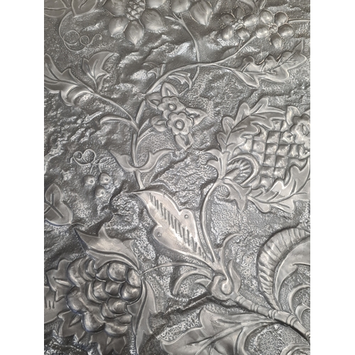 556 - 2 vintage Embossed Pewter wall hangings. Included are an Arts & Crafts round floral 43.5cm in diamet... 