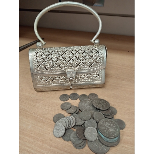 658 - White metal decorative vintage handbag with job lot of six pences and half crowns