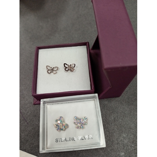 660 - Two pairs of 925 silver stud butterfly earrings boxed one with diamanté stones