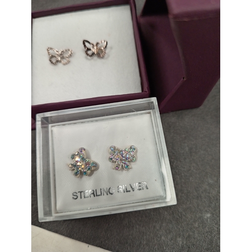 660 - Two pairs of 925 silver stud butterfly earrings boxed one with diamanté stones