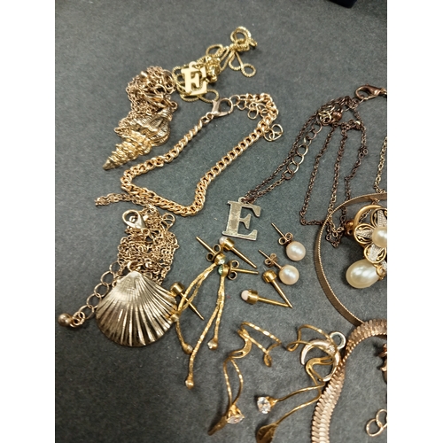 676 - Job lot of yellow metal jewellery includes bracelets necklaces, one with tiger eye pendant and earri... 