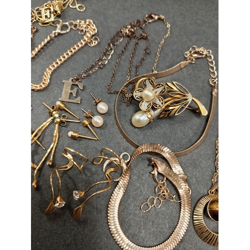 676 - Job lot of yellow metal jewellery includes bracelets necklaces, one with tiger eye pendant and earri... 