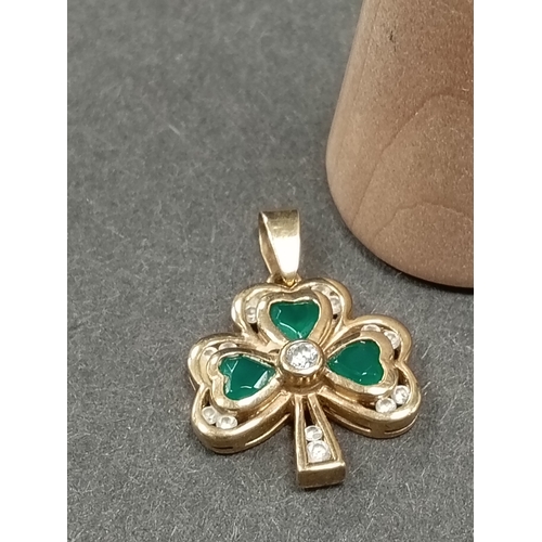 677 - 9ct gold green and clear stone shamrock pendant 1cm weight 2.72 grams