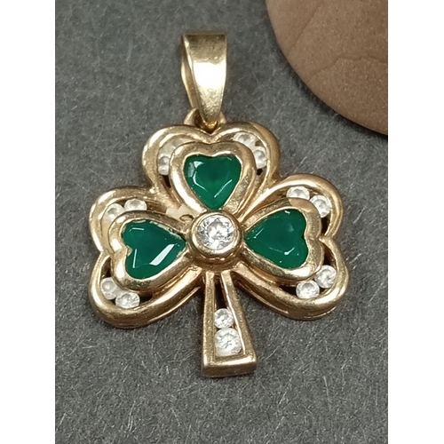 677 - 9ct gold green and clear stone shamrock pendant 1cm weight 2.72 grams