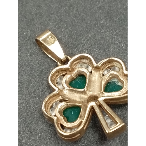 677 - 9ct gold green and clear stone shamrock pendant 1cm weight 2.72 grams