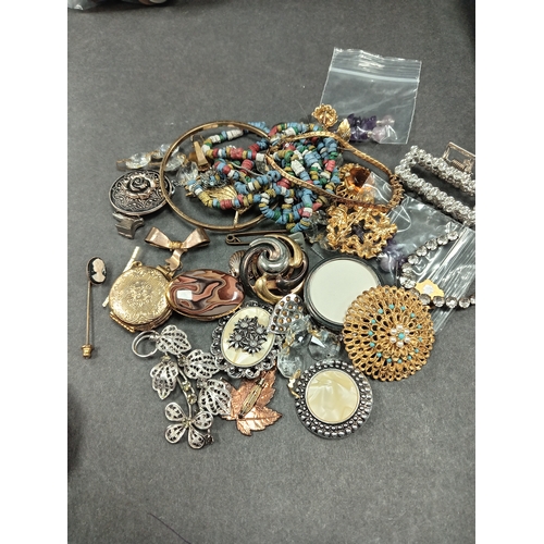 684 - Job lot of vintage costume jewellery includes scarf clips, gold colour locket brooch, bracelets and ... 