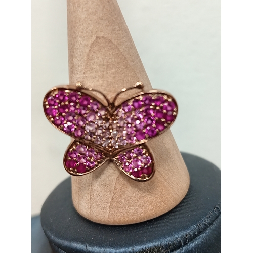 690 - 9ct gold butterfly ring with rubies size Q weight 3.48 grams