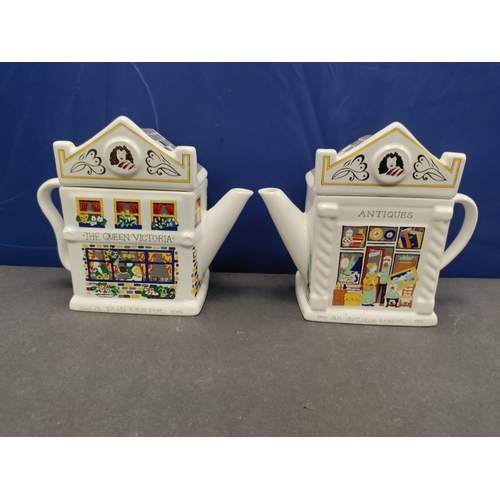 570 - A pair of English life teapots designs by Barry Smith and Barbara Wooton exclusively for Wade Englan... 