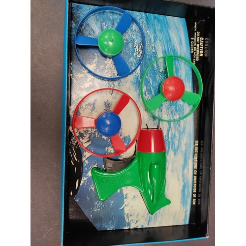 606 - Vintage Boxed Merit Planet Gun with 3 spinning wheels unused