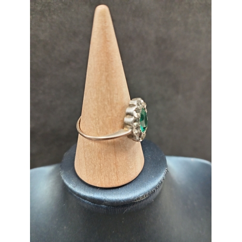 757 - 925 silver flower detail ring with green stone and diamanté stones size O