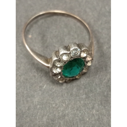 757 - 925 silver flower detail ring with green stone and diamanté stones size O