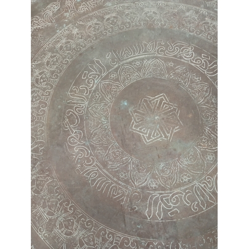 403 - Large engraved brass tray measures 56cm diameter