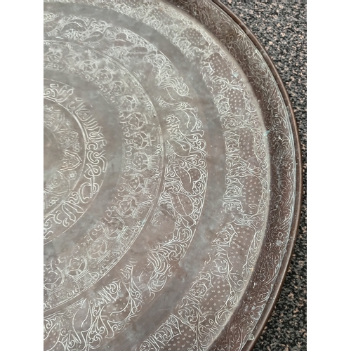 403 - Large engraved brass tray measures 56cm diameter