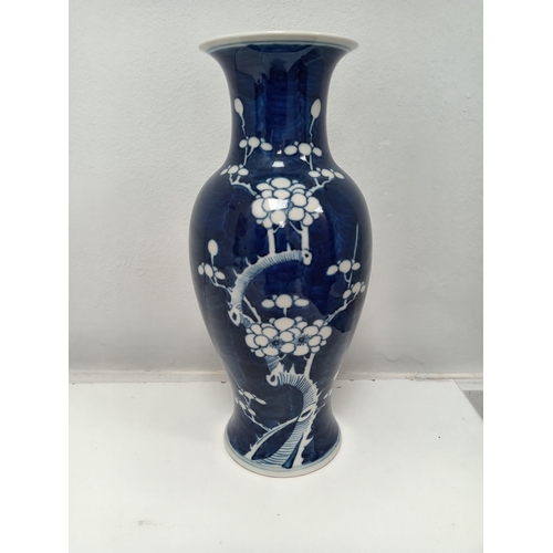 405 - Oriental Chinese blue and white prunus vase H 25cm x W 12cm