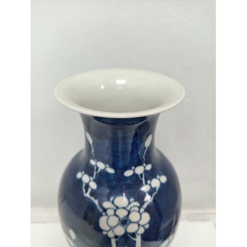 405 - Oriental Chinese blue and white prunus vase H 25cm x W 12cm