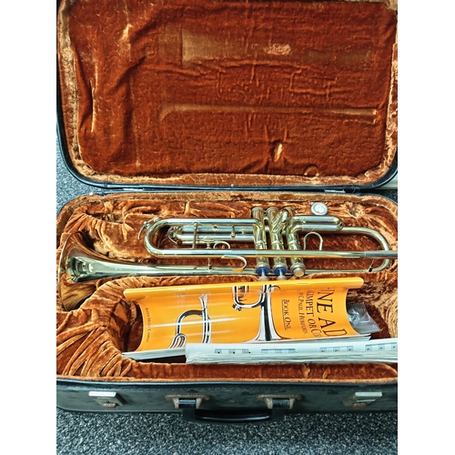 422 - Corton brass trumpet in original velvet lined case with music sheet books included