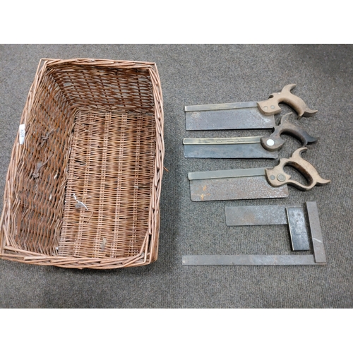 432 - A job lot of 3 antique saws and 2 set squares in a wicker basket. Makes include Alfred Ridge & Sons