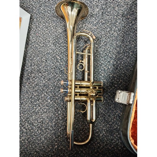 422 - Corton brass trumpet in original velvet lined case with music sheet books included