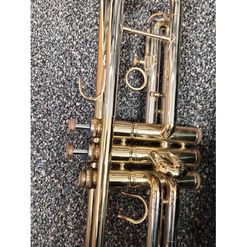 422 - Corton brass trumpet in original velvet lined case with music sheet books included