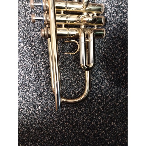 422 - Corton brass trumpet in original velvet lined case with music sheet books included