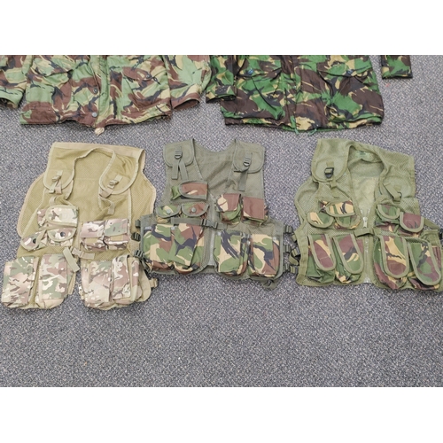 461 - A job lot of military gear. To include 2 camouflage jackets, 3 webbing vests, 1 camouflage vest, 1 s... 