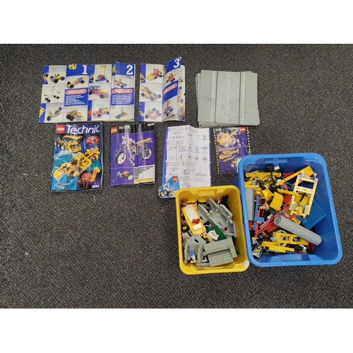 462 - Two boxes of Lego with lots of mini figures, roads and moving parts. Also includes 3 Meccano manuals... 