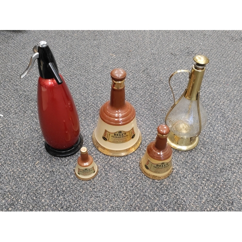 464 - A job lot of bottles. To include sparklets soda stream, Little Brown Jug musical decanter and 3 Bell... 